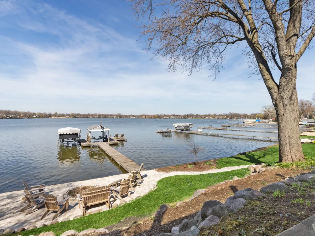 Docks and lakefront chairs on Diamond Lake in Mundelein, IL on a clear day